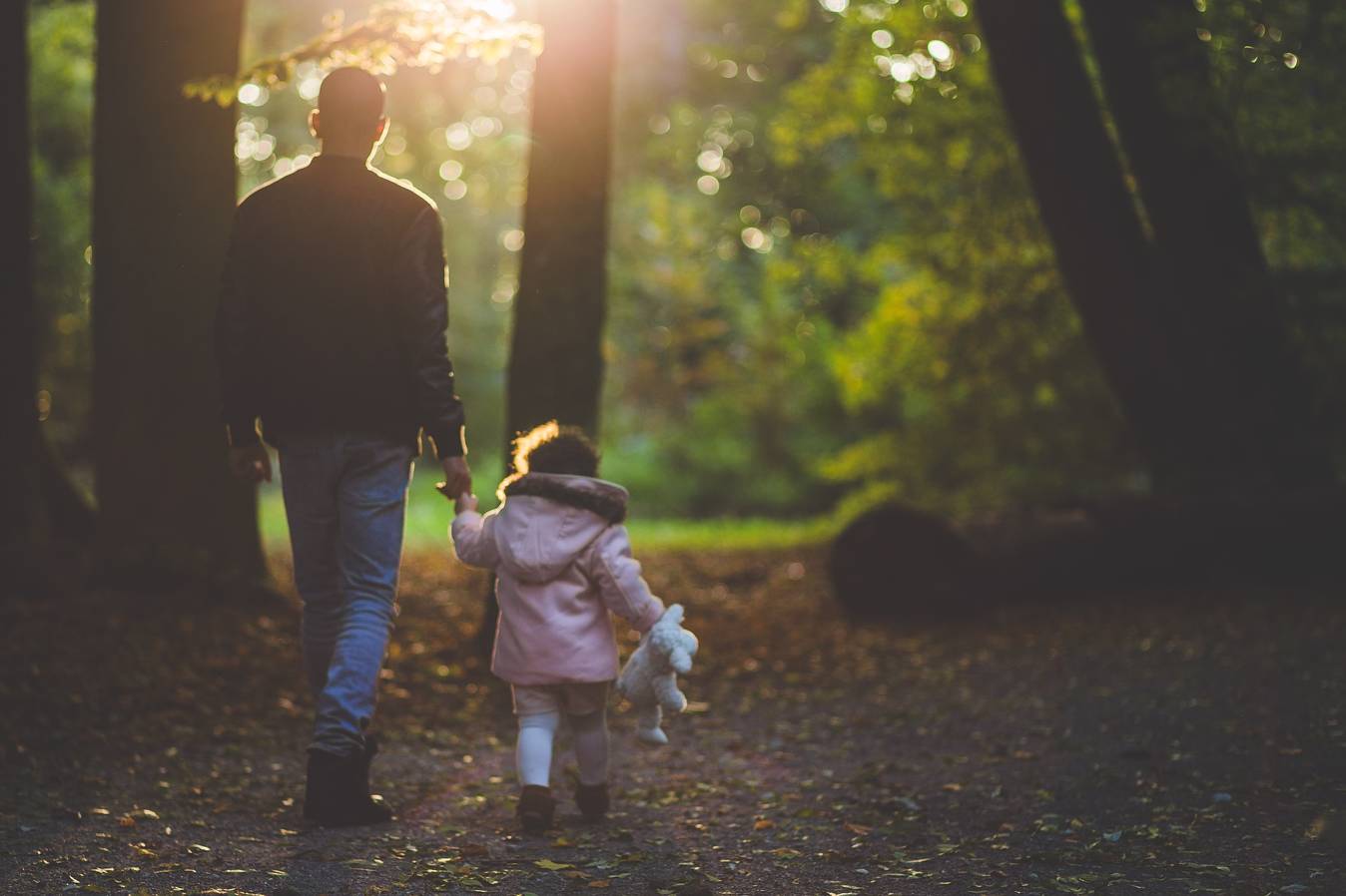 Father and child in forest